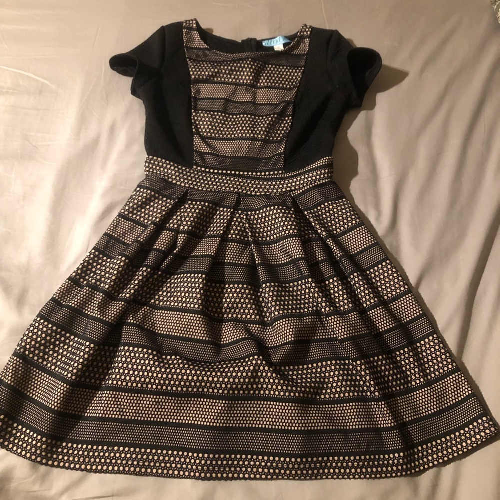 Cream and black midi A-line dress.